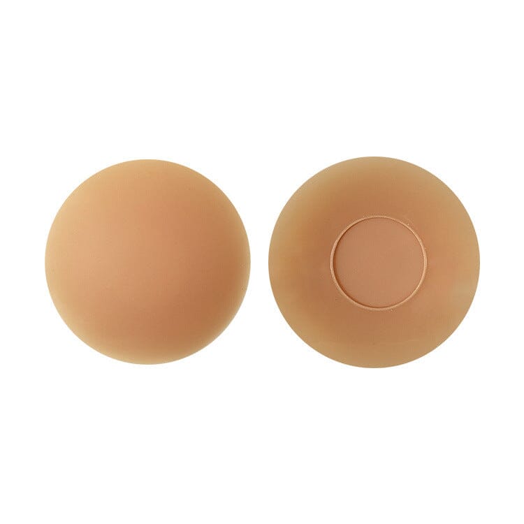Cache-tétons adhésif confort+ en silicone beige, idéal pour tenue invisible sous vêtements ajustés et sensibles.