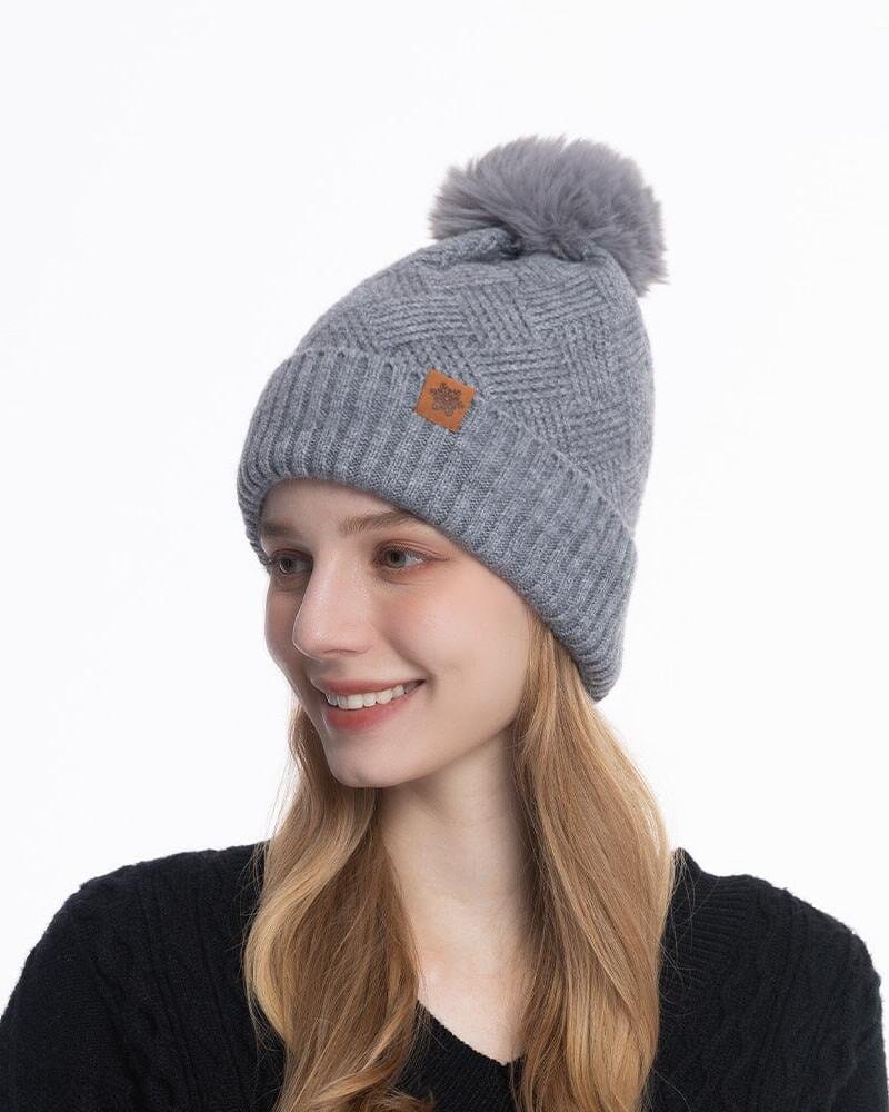 Bonnet gris Giada avec pompon en fausse fourrure élégante, nouveauté pour l'hiver, confortable et tendance.