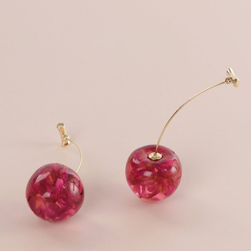 boucles d'oreilles sakura avec fleurs séchées roses et dorées, design élégant et délicat pour un look unique et naturel