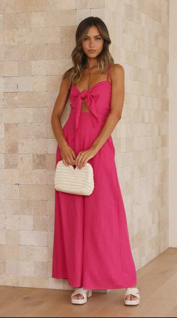 combinaison pantalon fluide rose avec noeud sur buste, idéale pour une tenue estivale élégante et confortable