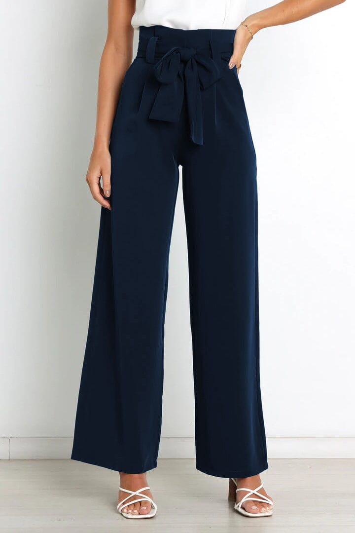 pantalon fluide taille haute bleu marine avec noeud à la taille, parfait pour un look élégant et confortable en toute occasion