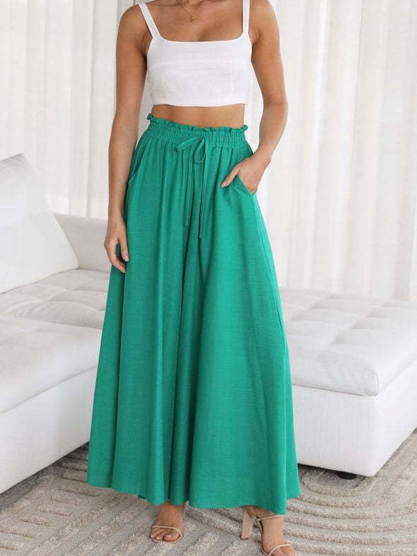 pantalon large fluide femme vert pour l'été, confortable et élégant, parfait pour un style décontracté et chic.