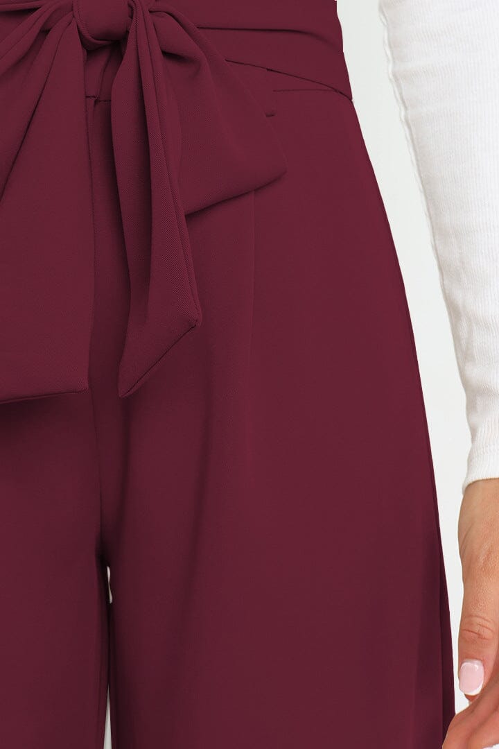 pantalon fluide taille haute olga en tissu léger couleur bordeaux avec ceinture nouée pour un look élégant et confortable