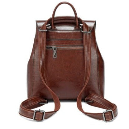 sac à dos en cuir marron pour femme avec une fermeture éclair et des bretelles ajustables, idéal pour la mode et le pratique