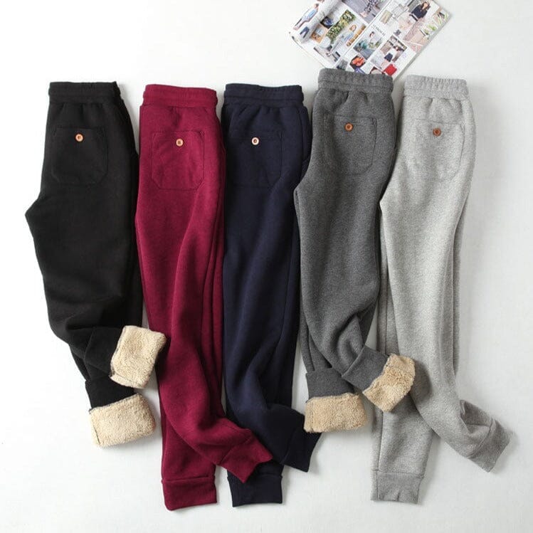 pantalons de jogging polaire pour femmes disponibles en plusieurs couleurs, y compris le noir, le rouge, le bleu et le gris.