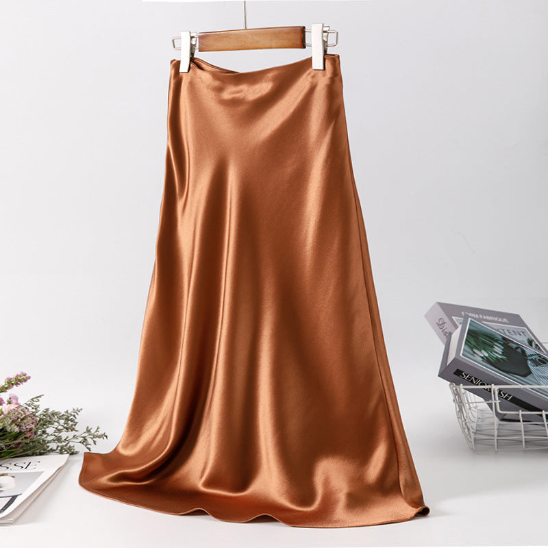 Jupe longue en satin couleur bronze élégante et fluide, idéale pour un look chic et sophistiqué. Parfaite pour l'été.